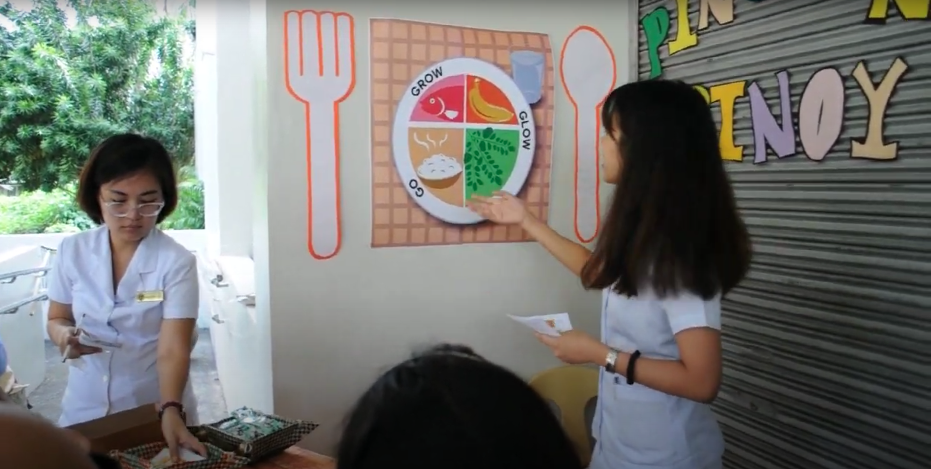 BSN studends explaining Pinggang Pinoy